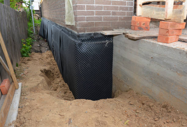 SJ Waterproofing Pros technician performing targeted Sump Pump Installation assessment in Marinette, WI